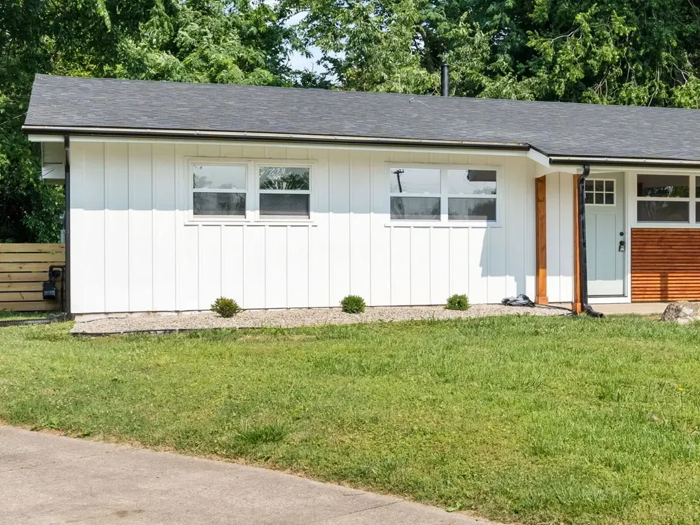 Ranch house with new siding and roof after renovation